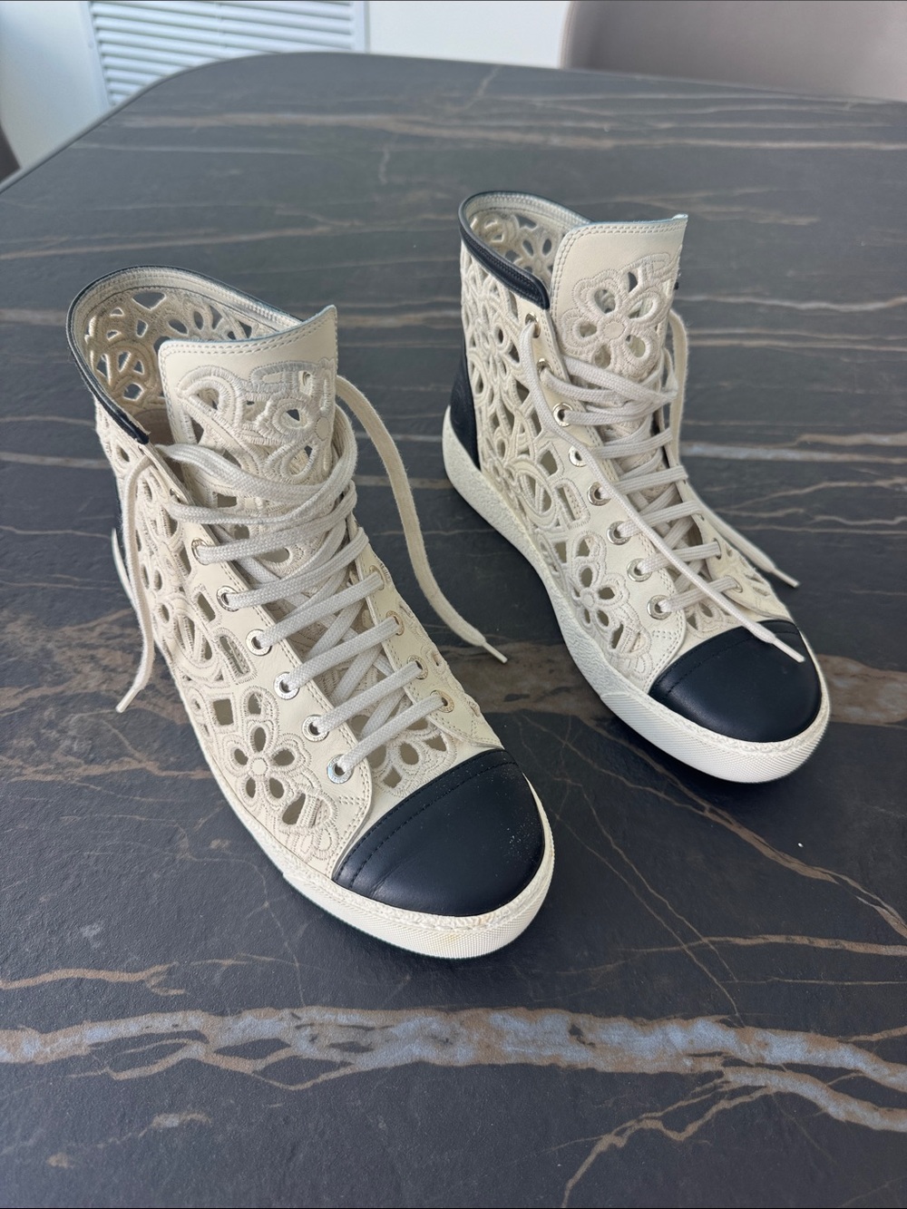 CHANEL Lace Cutout High-Top Sneakers — Cream with Black Toe